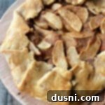 close up of Apple Crostata on a wood board