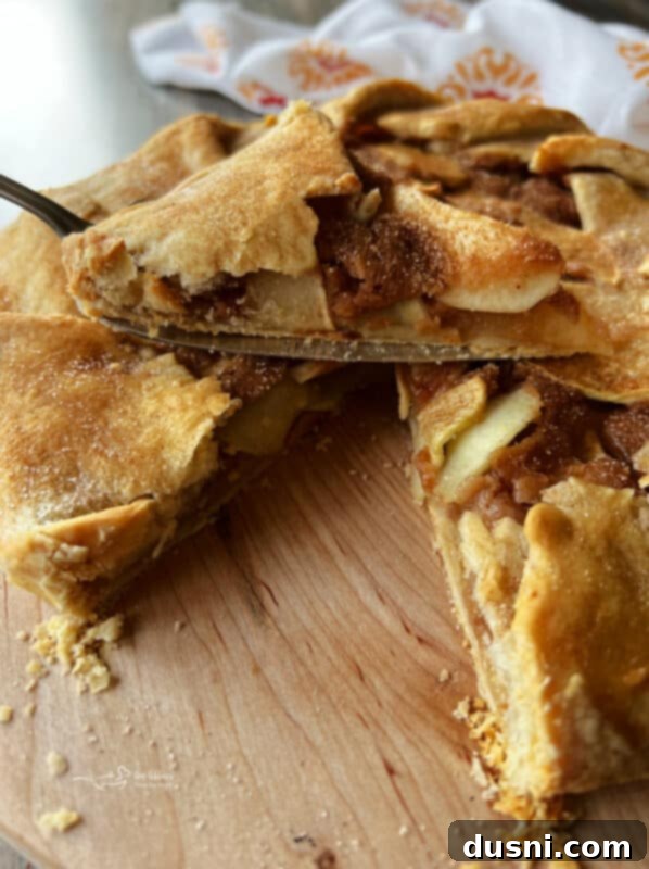 Delicious apple crostata slice with a scoop of ice cream