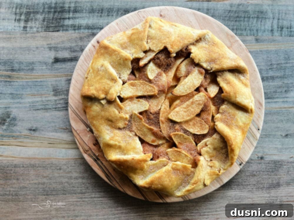 Close-up of a rustic apple crostata with golden crust
