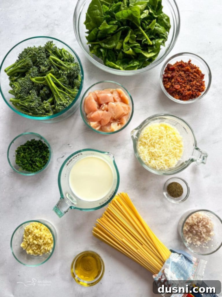 A close-up of the creamy carbonara sauce simmering in a skillet, with chicken pieces and bacon mixed in.