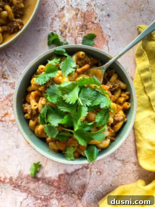 Hearty One-Pan Chili Mac 13 Chili Mac Skillet garnished with fresh cilantro.