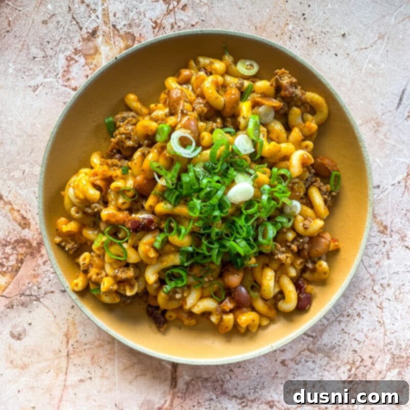 Hearty One-Pan Chili Mac 17 Chili Mac Skillet in a rustic pan, ready to be served.