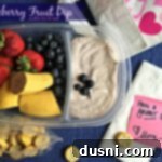 Velvet Blueberry Fruit Dip 2 blueberry fruit dip and a variety of fruits in a container with text "blueberry fruit dip"