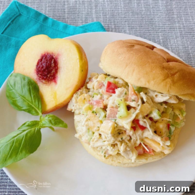 sandwich on white plate with peach