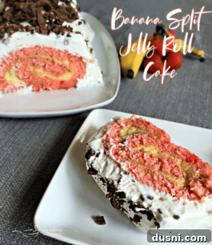Ultimate Banana Split Jelly Roll 7 Full Banana Split Jelly Roll Cake with a slice removed, showing the vibrant colors