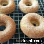Donuts on a cooling rack with text "baked banana donuts"
