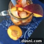 overhead of tea in a pitcher with text "{Anti} Prohibition Peach Tea"