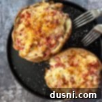 Close up of 2 Reuben stuffed baked potatoes