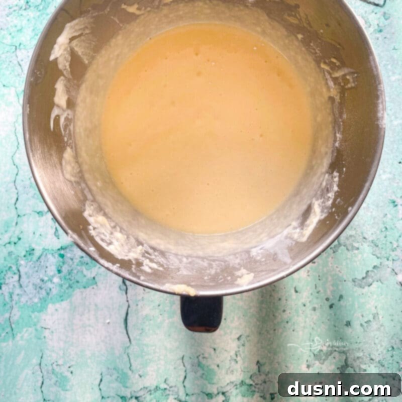 Adding flour and buttermilk to cake batter