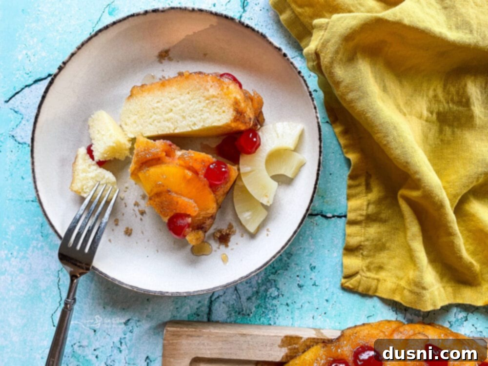 The Ultimate Homemade Pineapple Upside Down Cake 4 Pineapple Upside Down Cake slice with a scoop of ice cream