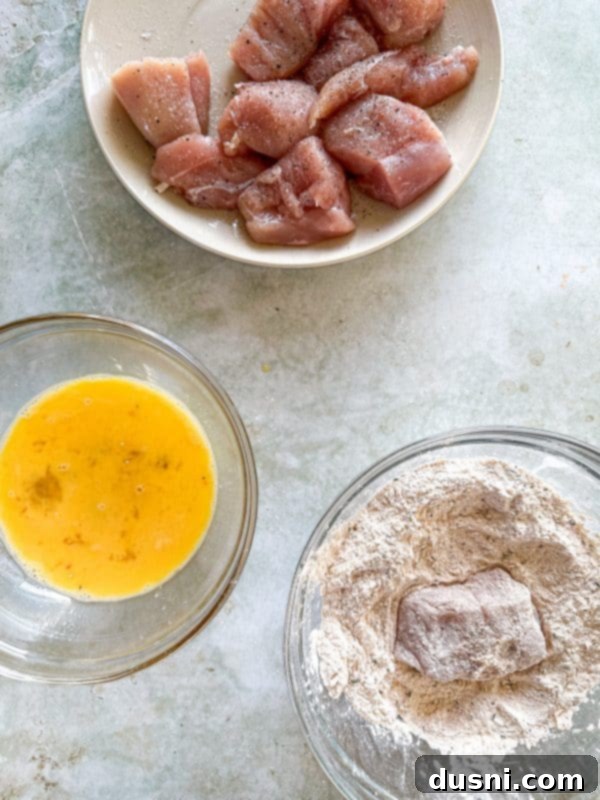 Honey-Glazed Crispy Fried Chicken 10 Fifth step: coating chicken in flour, egg, then flour again.