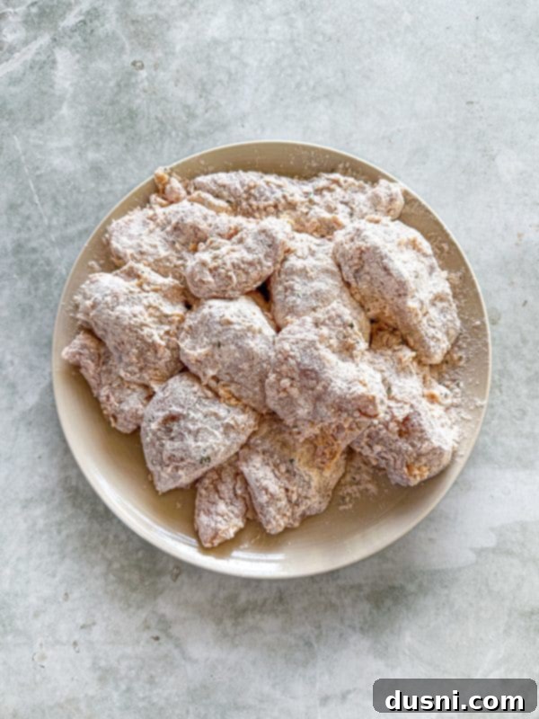 Honey-Glazed Crispy Fried Chicken 11 Sixth step: frying chicken in hot oil until golden brown.