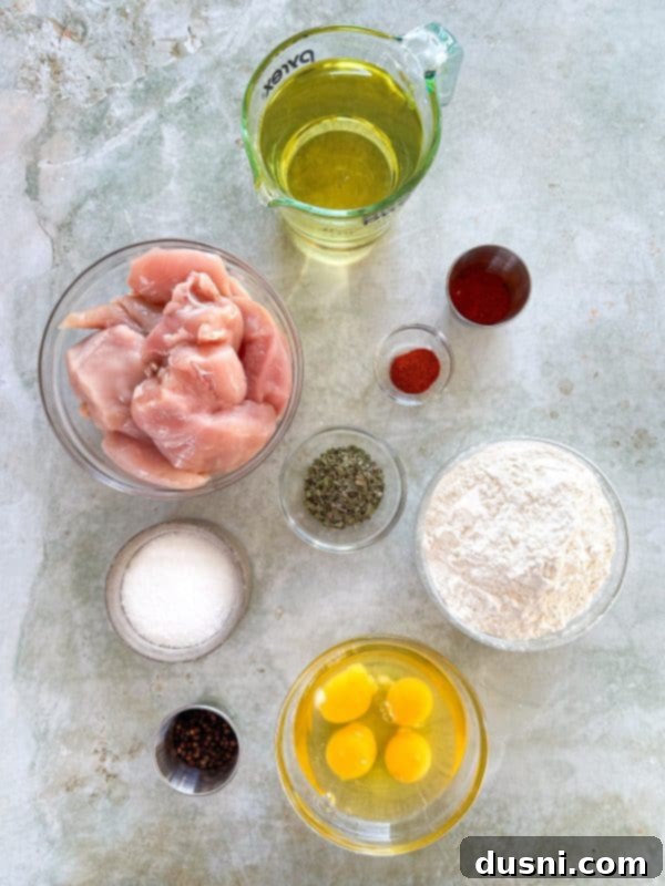 Honey-Glazed Crispy Fried Chicken 5 Ingredients laid out for honey fried chicken.