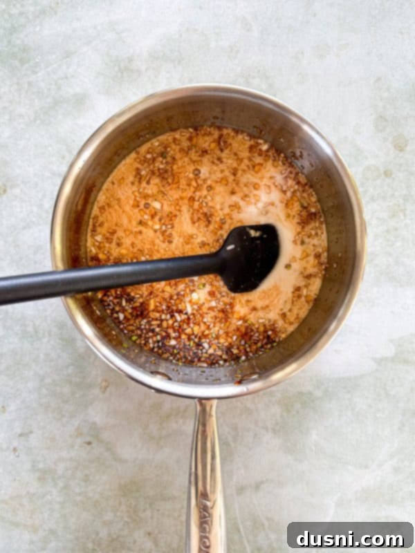 Honey-Glazed Crispy Fried Chicken 8 Second step: adding cornstarch mixture to the sauce to thicken.