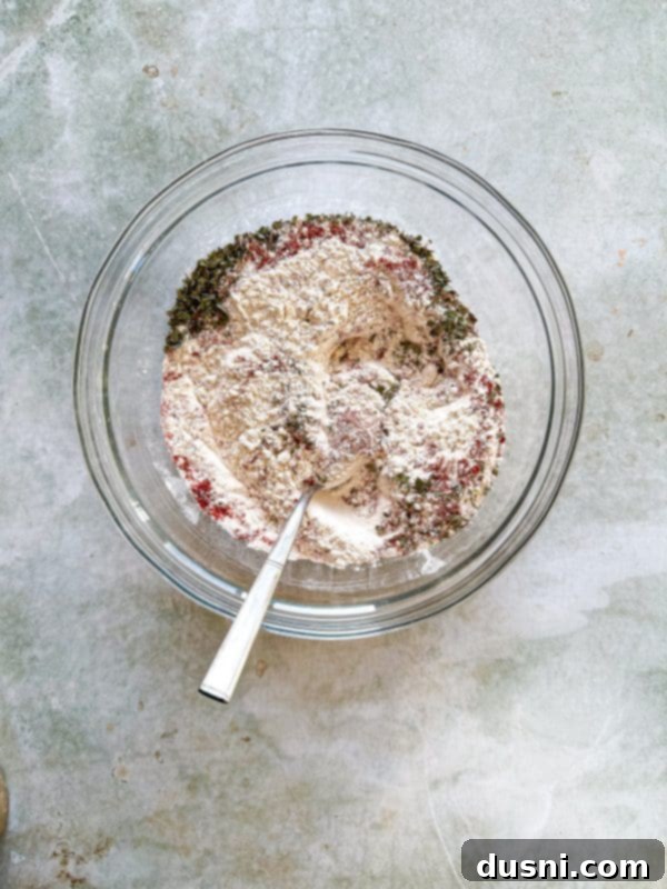 Honey-Glazed Crispy Fried Chicken 9 Third step: combining flour and spices in a bowl.