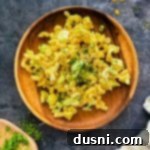 Mom's Macaroni salad on a wooden plate.