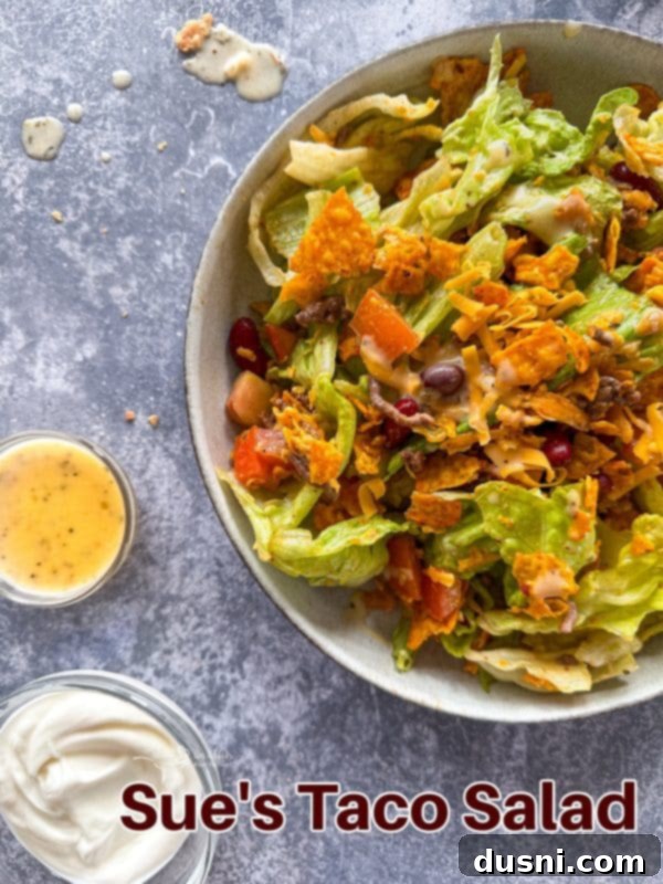 Ultimate Doritos Taco Salad 14 A large serving bowl filled with a fresh and colorful Doritos Taco Salad, beautifully arranged for a hero shot.