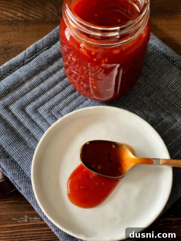 Homemade BBQ Sauce in a small bowl with a spoon