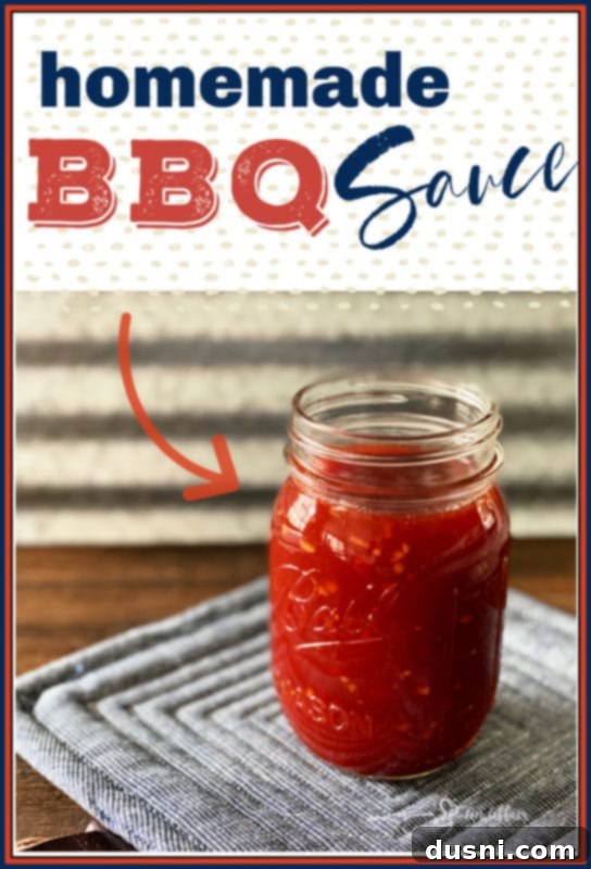 The Perfect Homemade BBQ Elixir 5 Homemade BBQ Sauce in a clear glass jar on a wooden surface