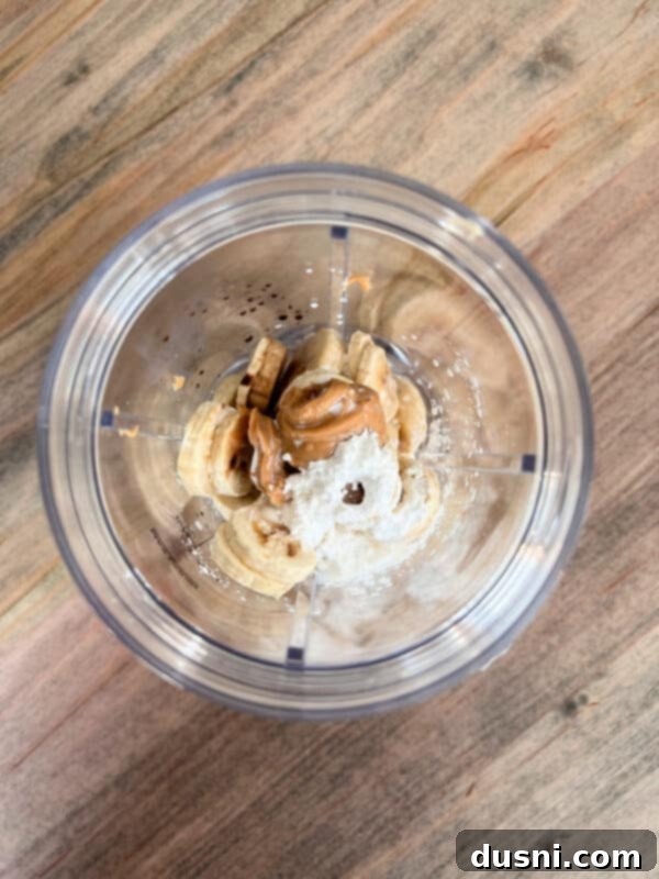 Creamy Peanut Butter Banana Delight 4 Frozen banana slices on a plate