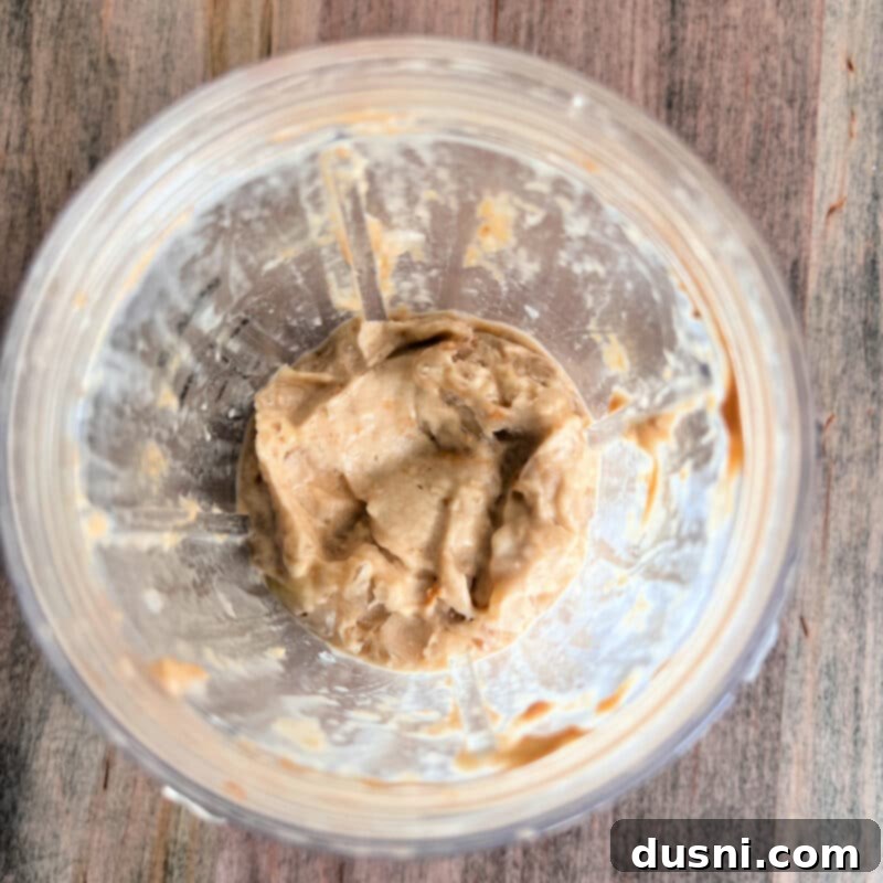 Creamy Peanut Butter Banana Delight 5 Blended peanut butter banana nice cream in a blender