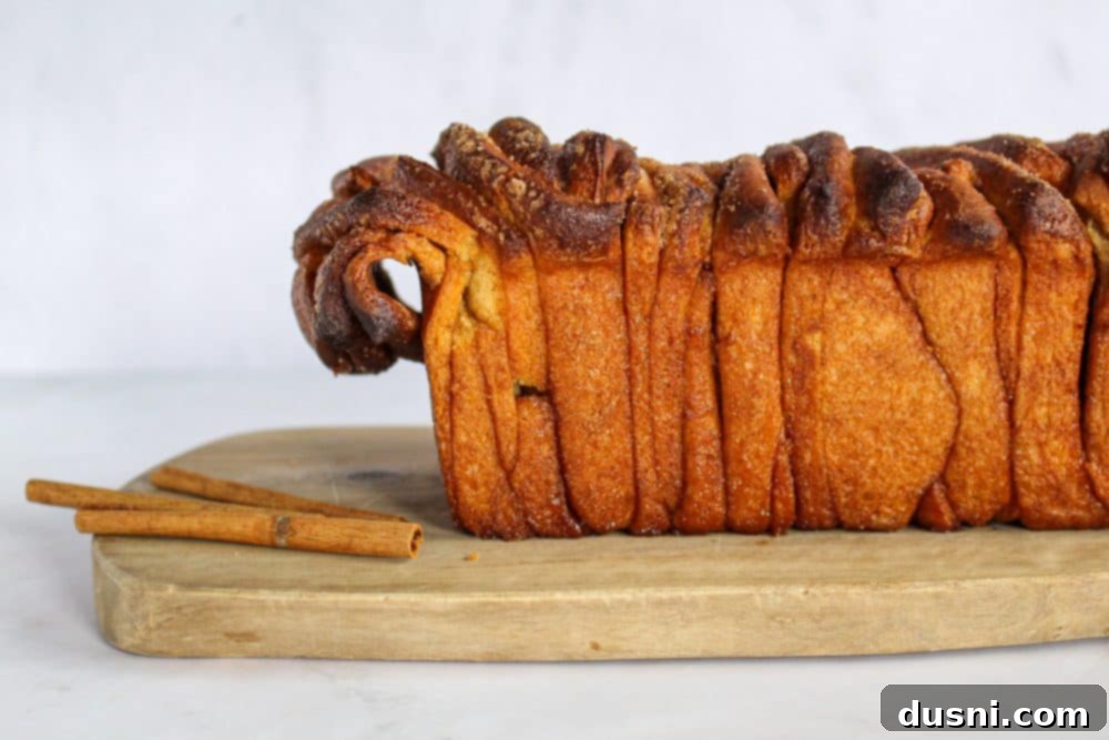 Warm Cinnamon Pull-Apart Perfection 3 Close up of frosted cinnamon pull apart bread slices showing layers