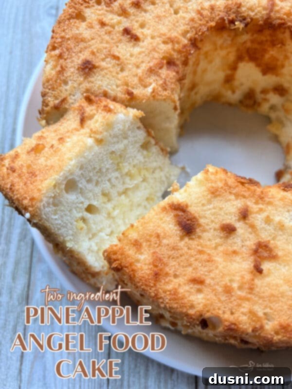 Close-up of a beautifully golden brown baked pineapple angel food cake in a tube pan