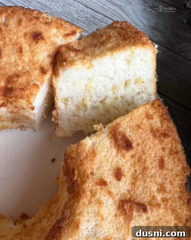 A person holding a can of crushed pineapple next to a box of angel food cake mix