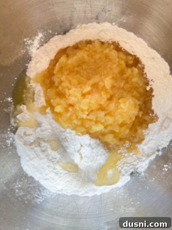 An empty angel food cake pan on a counter, waiting for batter