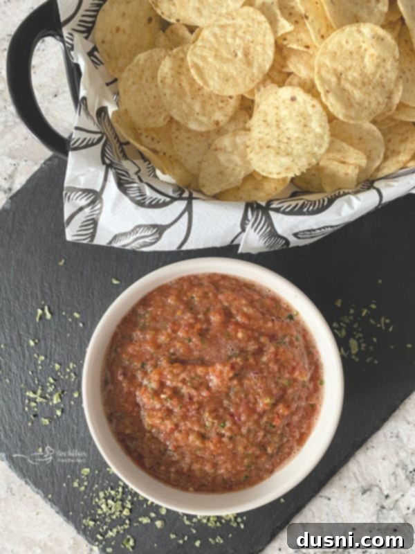Easy Dump Salsa with a basket of tortilla chips, ready to serve