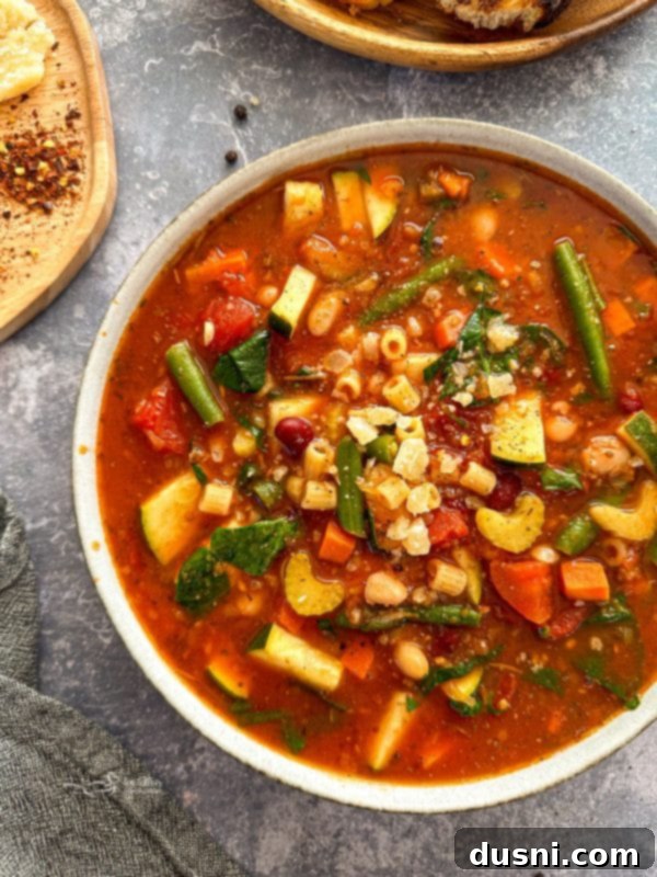 Simmered Garden Minestrone 2 Crock Pot Minestrone Soup simmering, showcasing the vibrant vegetables.
