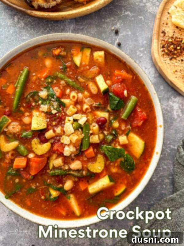 Simmered Garden Minestrone 15 Crock Pot Minestrone Soup in a bowl with text overlay.