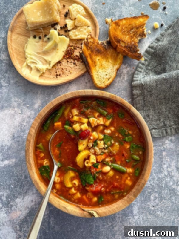 Simmered Garden Minestrone 5 A bowl of Minestrone Soup with fresh herbs.