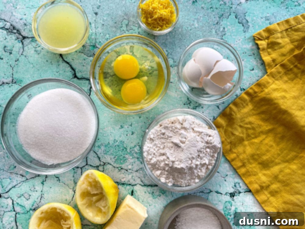 ingredients for lemon squares including fresh lemons, softened butter, granulated sugar, all-purpose flour, and eggs
