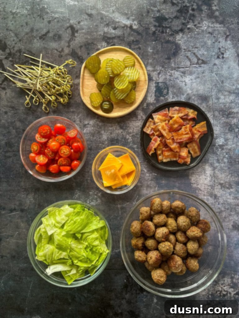 A vibrant platter of Bacon Cheeseburger Meatballs with various toppings