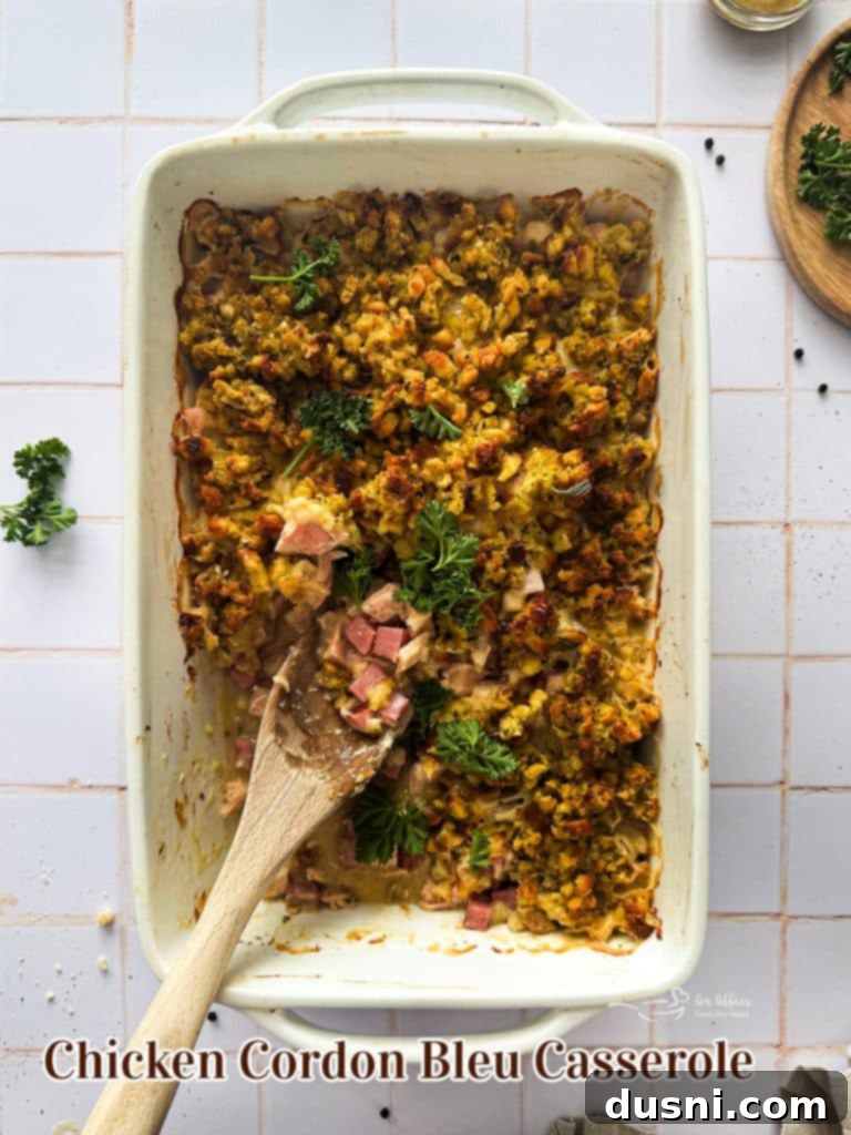 Creamy Chicken Cordon Bleu Bake 12 A hero shot of the baked Chicken Cordon Bleu Casserole, showcasing its golden stuffing and bubbly, cheesy interior.