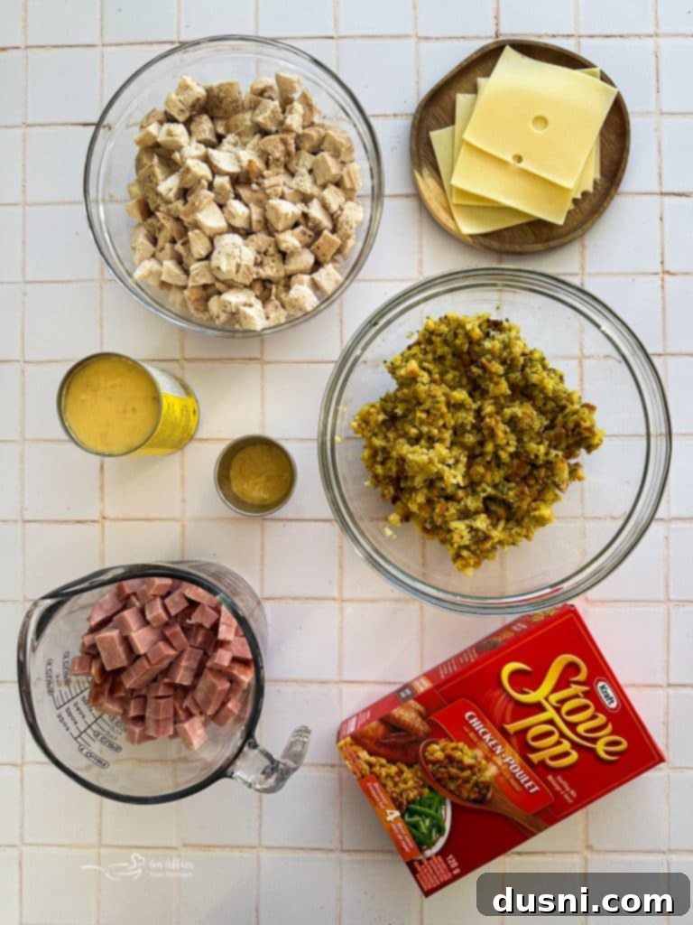 Creamy Chicken Cordon Bleu Bake 4 Overhead shot of the Chicken Cordon Bleu Casserole in a baking dish before baking, showing the layers of chicken, ham, and cheese, ready for the stuffing topping.