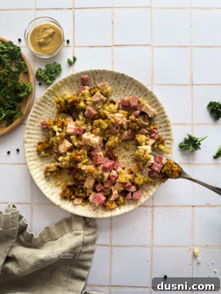 Creamy Chicken Cordon Bleu Bake 5 All the ingredients for Chicken Cordon Bleu Casserole laid out on a kitchen counter: chicken, ham, Swiss cheese, cream of chicken soup, Dijon mustard, and stuffing mix.