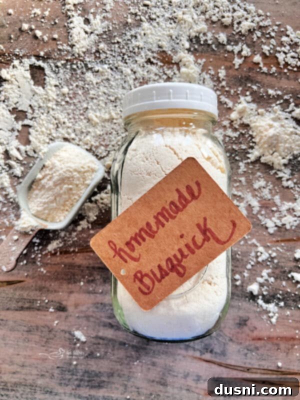 Better Bisquick From Your Kitchen 13 A large bowl of homemade Bisquick mix with a measuring cup