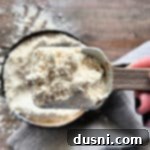 Better Bisquick From Your Kitchen 17 Homemade Bisquick mix up close on a measuring spoon
