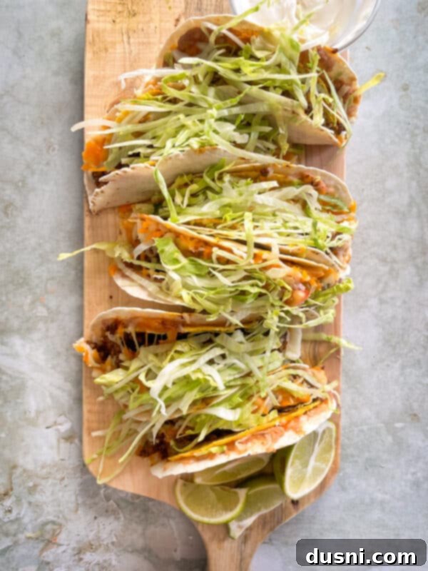 Serving Baked Double Decker Tacos with toppings