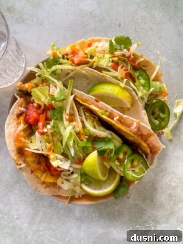 Two Double Decker Tacos on a white plate