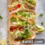 Double Decker Tacos layered on a wood board