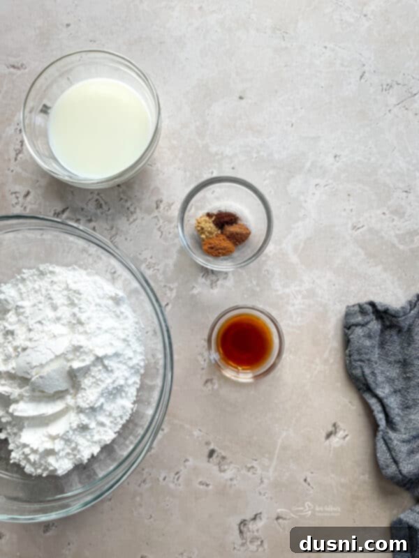 Ingredients for Spiced Donut Glaze, including powdered sugar, milk, vanilla extract, and various spices.