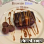 Overhead of brownie bites with rolos and caramel sauce drizzled over it. Text 'Brownie Bites with Rolos'