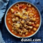 Chicken Parmesan soup in a blue bowl