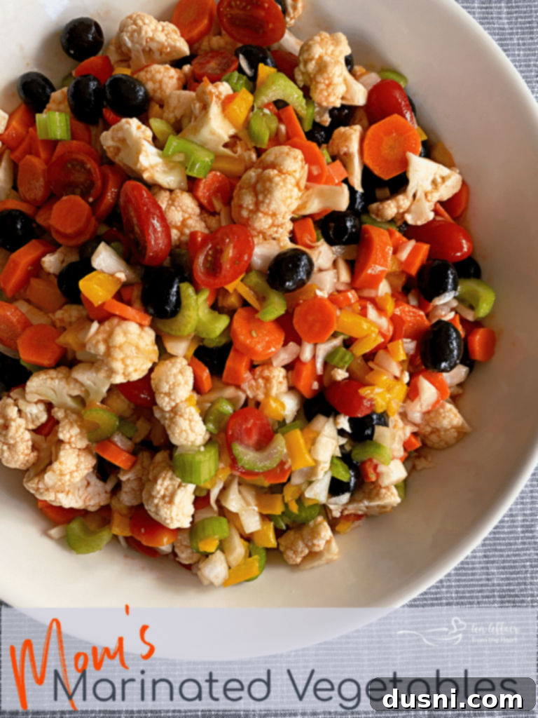 Zesty Marinated Veggies 11 Overhead shot of Mom's Marinated Vegetables in a white serving bowl, ready to be pinned.