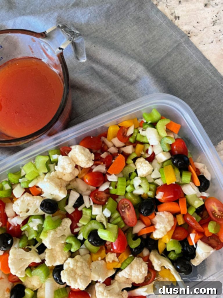 Zesty Marinated Veggies 12 Ingredients for the marinade and chopped vegetables laid out before mixing.