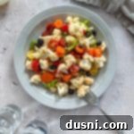 Zesty Marinated Veggies 17 A piece of cauliflower on a fork.