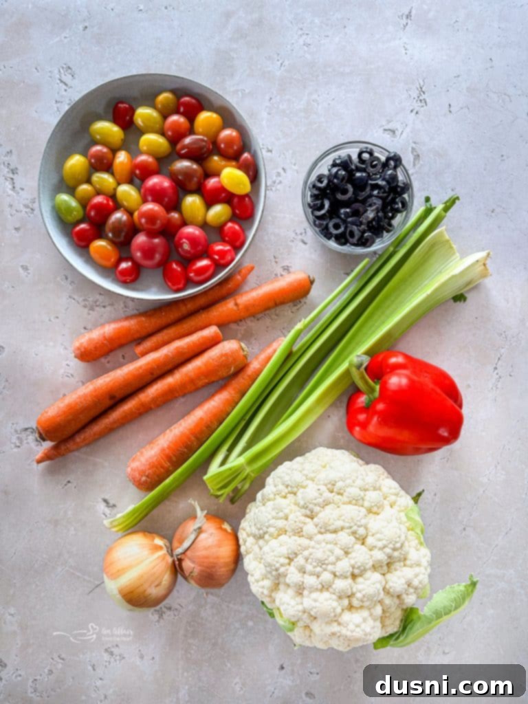 Zesty Marinated Veggies 3 A close-up shot of the colorful marinated vegetable salad in a clear glass bowl, showcasing the dressing and fresh ingredients.
